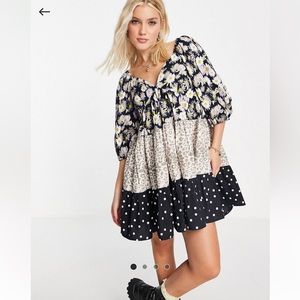 mixed print tiered babydoll mini dress.